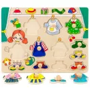 Fogantyús lapöltöztető lányos